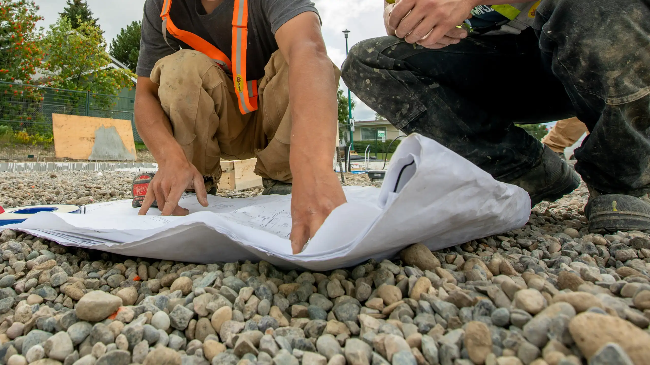 Workers looking at plans